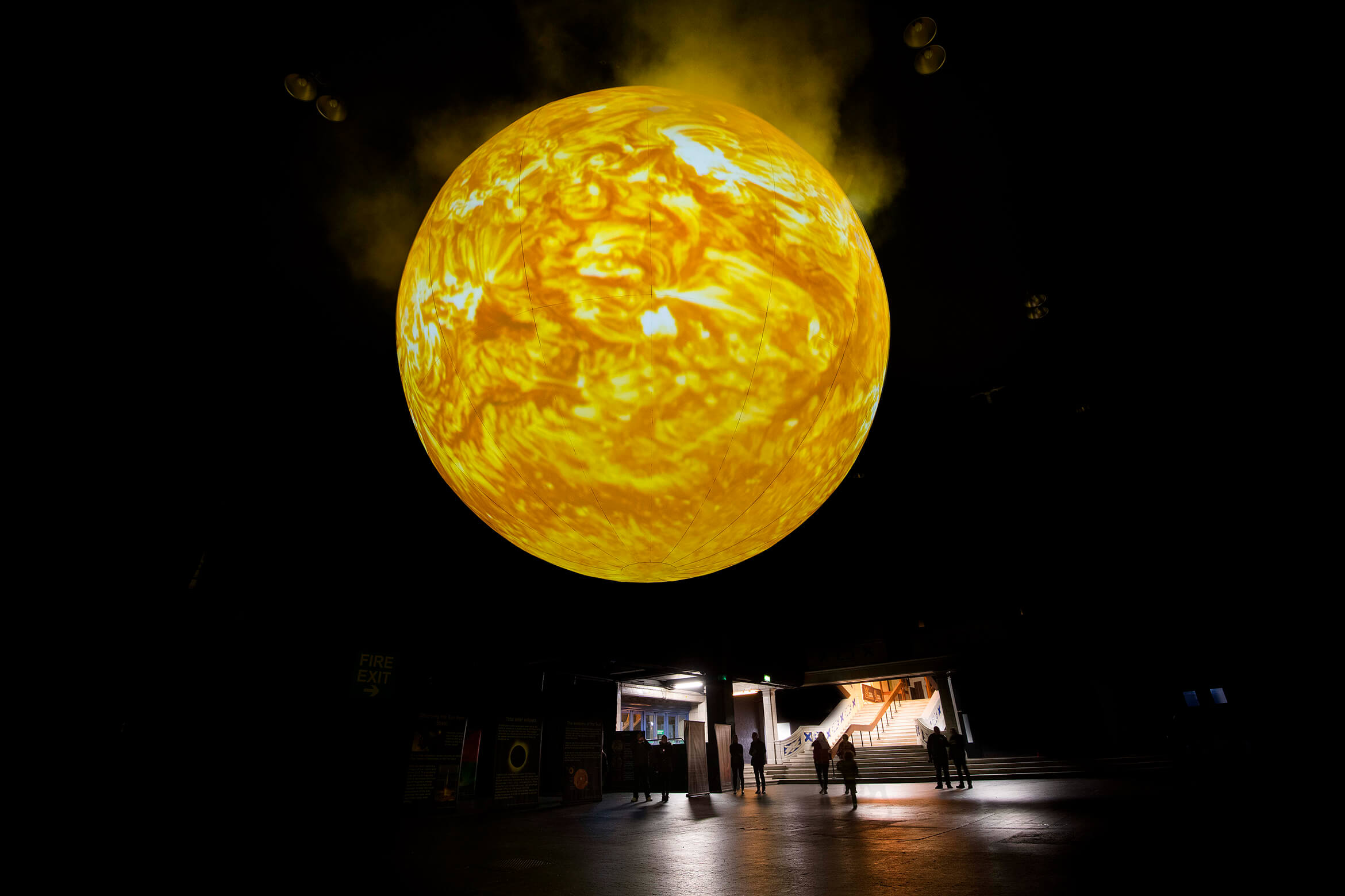 Photograph of SUN showing the scale compared to the people and space it is in